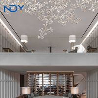 Lustre géant personnalisé à fleurs en cristal de style luxe moderne pour décoration intérieure escalier en colimaçon hôtel mariage