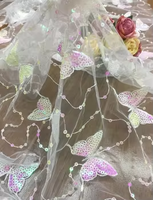 Prix de gros dentelle maille sequin tissu de broderie à la main papillon sequin tissu pour femmes vêtements