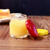 Vente flash Mini pot en verre rond vide de 30 ml 50 ml pour confiture, miel, aliments, épices avec couvercle en métal à vis