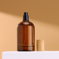 Botol parfum kaca Amber bulat 30ml 50ml 100ml dengan tutup bambu dan penyemprot pompa tipe segel elegan