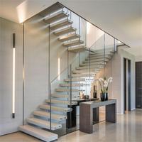 Escalier flottant intérieur moderne à bande ouverte, design durable en acier inoxydable avec hauteur de contremarche personnalisable pour appartements