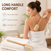Brosse de douche double face en bois de lotus laqué avec poils de sanglier et nylon, bandes antidérapantes bleues et cordon de suspension blanc