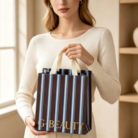 Sacs en papier kraft personnalisés avec poignées en coton, sacs de shopping en papier rayés en gros avec logo imprimé pour l'emballage de cadeaux de détail