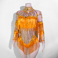 Combinaison de danse sexy à manches longues en spandex/coton, dos nu, en maille transparente, ornée de strass scintillants et de franges, pour costumes de scène et tenues de drag.