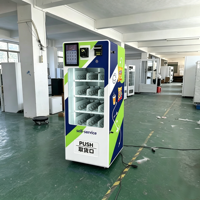 Petite machine distributrice de boissons, de collations et de produits de beauté à monnayeur pour centres commerciaux et galeries.