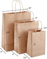 Sacs en papier kraft de luxe pour cadeaux, vente en gros d'usine OEM, pas cher, avec logo personnalisé
