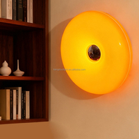 Lampe murale LED en forme de donut avec luminosité réglable et commande tactile, design moderne pour chambre à coucher