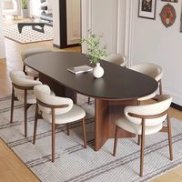 Table à manger ovale en bois antique de style français simple et haut de gamme avec plateau en dalle de roche et combinaison de chaises pour 6 personnes