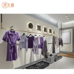 Estantes de exhibición montados en la pared de durabilidad de alta calidad para tienda de ropa personalizable necesita tienda fábrica de vitrina de ropa