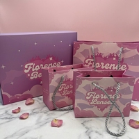 Ventes en gros pour l'emballage de cadeaux avec poignée en coton, impression de logo rose, sacs en carton blanc, emballage de sacs en papier cadeau