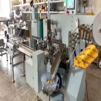 Machine d'emballage automatique continue pour lingots de chocolat imprimés en feuille d'or, avec scellage thermique et personnalisation