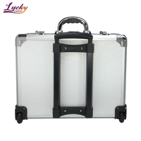 Valise professionnelle rigide en aluminium avec roulettes universelles, étanche et antichoc, personnalisable OEM/ODM, pour le transport et le rangement professionnel