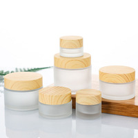 Pot cosmétique givré en verre de crème de visage de beurre corporel de l'usine chinoise personnalisé 5g 10g 15g 30g 50g 100g avec couvercle en bambou