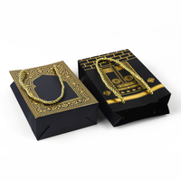 Sac cadeau en carton noir mat épais avec logo personnalisé pour l'emballage de vêtements et de produits de vente au détail