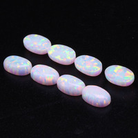 Cabochons d'opale blanche de qualité OP17 Opale de feu synthétique à fond plat en forme d'oeuf Gemmes en vrac pour bagues Forme de pierre précieuse ovale