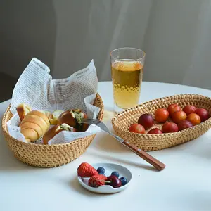 Vendita calda cesto di vimini in vimini tessuto a mano ovale per la decorazione della tavola di conservazione di caramelle di frutta vegetale