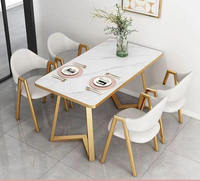Ensemble de table à manger en marbre de luxe moderne avec chaises en cuir PU et cadre doré, meubles pour salle à manger, café, restaurant