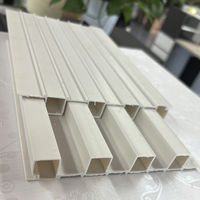 Panel dinding pvc butiran kayu pop dikirimkan Panel dinding bergalur harga baru pabrik