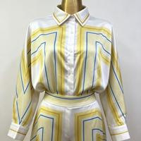 Ensemble deux pièces de luxe pour femme 2026, toucher satiné, imprimé lignes géométriques jaunes, chemise à manches longues et pantalon droit