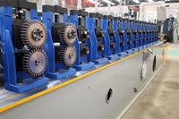 Machine de formage à rouleaux pour profilés de portes de garage à enroulement, machine de fabrication de lames de portes enroulables