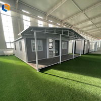 Maison conteneur moderne pliable à double aile extensible, étanche et isolée, préfabriquée pour projets de camping et d'hébergement