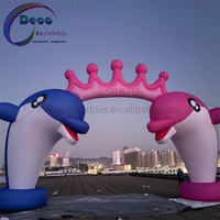 Arche gonflable personnalisée en forme de dauphin avec couronne rose pour les fêtes d'anniversaire des enfants et la décoration d'événements aquatiques