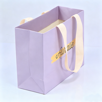 Fournisseur de sacs en papier violet clair personnalisés de luxe avec poignées en ruban pour cosmétiques, lotions, maquillage, rouges à lèvres, perruques, cadeaux et shopping