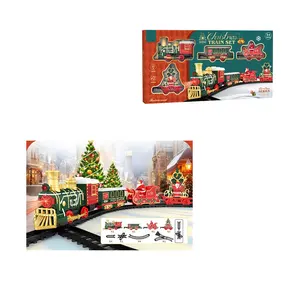 I classici giocattoli del treno di Natale impostano il treno elettrico con il suono e le luci delle auto tracciano i regali di Natale per bambini