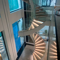 Escalier en colimaçon moderne en acier inoxydable finition or avec marches en marbre pour usage intérieur en villa, Foshan