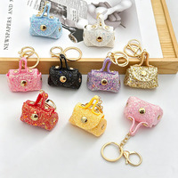 Mini sac à main pailleté en cuir avec porte-clés et fermoir métallique pour rangement d'écouteurs et décoration de sac, pendentif pour écouteurs, monnaie et sac à main