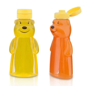 Bouteilles de miel en forme d'ours mignonnes de qualité <span class=keywords><strong>alimentaire</strong></span> 8 oz 16 oz, contenants en <span class=keywords><strong>plastique</strong></span> PET transparent de 250g 500g avec bouchon à clapet jaune - Product Image 1