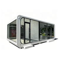 Maison conteneur modulaire en acier pliable moderne, type Apple Cabin, utilisable comme hôtel, entrepôt, bureau ou logement.