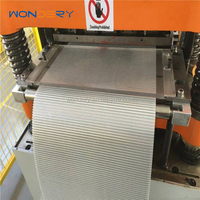 Machine de fabrication de formage, d'estampage et de poinçonnage de calandres en aluminium à ailettes décalées WONDERY