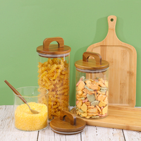 Pot alimentaire rond en verre transparent de 700 ml, 1000 ml, 1400 ml avec bouchon en bois et poignée pour le stockage de friandises, bonbons et biscuits