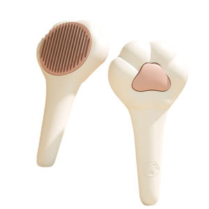 Venta al por mayor de alta calidad con forma de pata bonita mascota perro limpiador cepillo masaje un toque eliminación de pelo acero piojos gato peine - Product Image 1