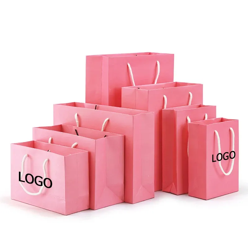 Sacchetti di carta stampati di lusso personalizzati con lamina d'oro rosa, borsa della spesa rosa con finitura testurizzata di alta qualità con nastro rosa