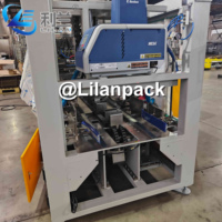 Machine d'emballage automatique en caisse enveloppante pour bidons de lait et fûts de boissons minérales