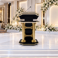Pupitre de conférence noir et or brillant avec étagères de rangement pour réceptions de mariage, banquets d'hôtel et événements