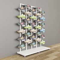 Support d'affichage de chaussures de sport en fer pliable et rotatif à une face, pour magasins de chaussures commerciaux, avec un design moderne et léger