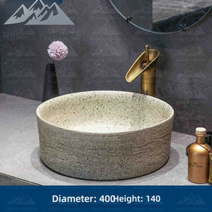 Lavabo rond sur plan en céramique texturée motif pierre Wayon pour projet hôtelier de luxe - Product Image 6