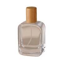 Vente en gros de flacons de parfum en verre transparent de 30 ml, 50 ml et 100 ml avec pulvérisateur à pompe et couvercle en bois pour parfum, flacon cosmétique sérigraphié