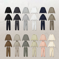 Ensemble de survêtement personnalisé brodé avec motif crâne et squelette, comprenant un sweat à capuche zippé intégral et un pantalon de jogging, idéal pour l'entraînement et le sport.