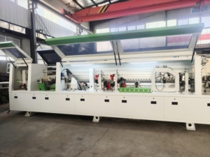 เครื่องจักรปิดขอบแผ่นไม้แบบอัตโนมัติ JUNDE 17.5KW สำหรับงานอุตสาหกรรม พร้อมระบบกัดแต่งขอบสองด้าน สำหรับขาย - Product Image 2