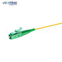 Pigtail Serat Optik Singlemode G652.D Tipe LC APC Desain Berpelapis Rapat untuk Instalasi Jaringan FTTH Kabinet Dalam Ruangan