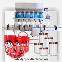 Machine de remplissage et de pesage pour pots et bouteilles de 200g de granulés de chocolat et de noix pour éclairs