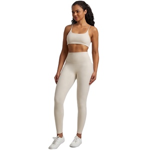 Traje de entrenamiento de Yoga de gimnasio impermeable para mujer, venta al por mayor, mallas deportivas de dos piezas con sujetador, conjunto de patrón sólido - Product Image 4