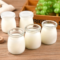 Gobelets en verre résistant à la chaleur en gros avec couvercles en bois naturel 100ml 150ml 200ml pour la pâtisserie et l'emballage de desserts