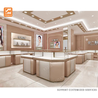 Vitrine à bijoux élégante en verre avec éclairage LED, comptoir de présentation, mobilier de magasin de bijoux en acier inoxydable sur mesure pour la vente au détail