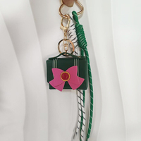 Nouveau porte-clés tendance pour femme avec nœud papillon, mini sac décoratif en PU en forme de sac, cordon de suspension populaire