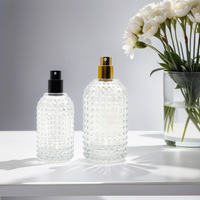 Fabricant à vendre Pompe de pulvérisation au design unique Bouteille en verre de parfum en forme de cylindre rond de 50ml